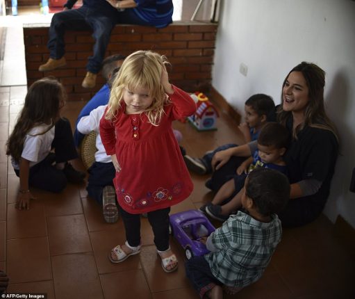 Help: Daniela Olmos, president and founder of the Kapuy Foundation, which supports children in situation of abandonment or with serious health problems, including undernourishment, plays with children in Maracay, Aragua state